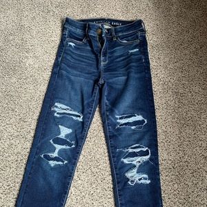 American Eagle distressed dark denim jean.